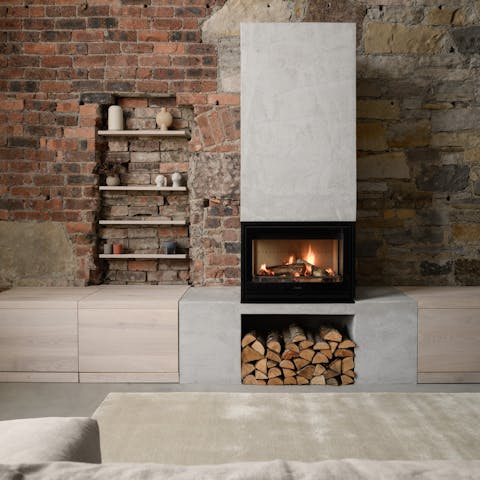 Cosy up by the modern fireplace in the lounge