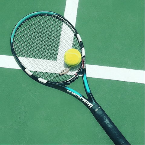 Challenge your loved one to a tennis match on the shared courts