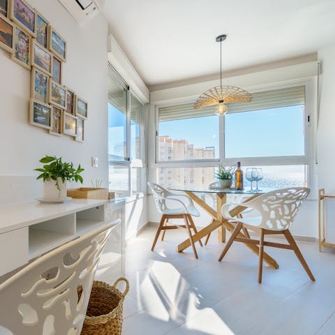 Sip wine in your bright apartment with sea views