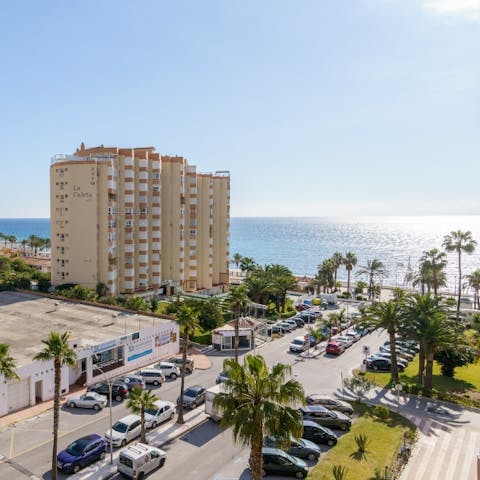 Stay just metres from the sea at Torrox Beach, a forty-five-minute drive from Malaga