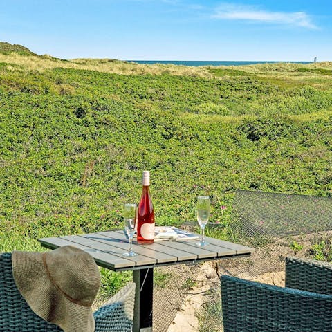 Enjoy a glass of wine on the terrace and admire views of the ocean