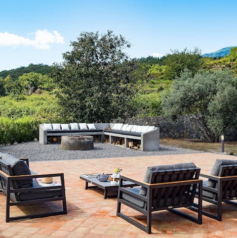 Gather together by the firepit with Mt Etna as the backdrop