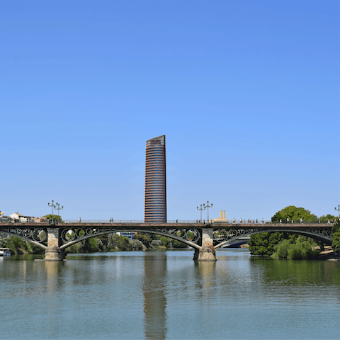 Visit the famous Triana Bridge, just a short stroll from the home
