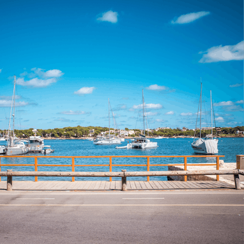 Stroll around Portocolom, stopping off to sample some local cuisine