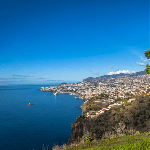 Find the best view of Madeira's coastline — try the Pico dos Barcelos Lookout, a nine-minute drive away