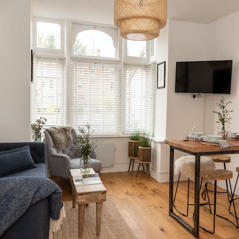 Put your feet up in the naturally themed and light-filled living space