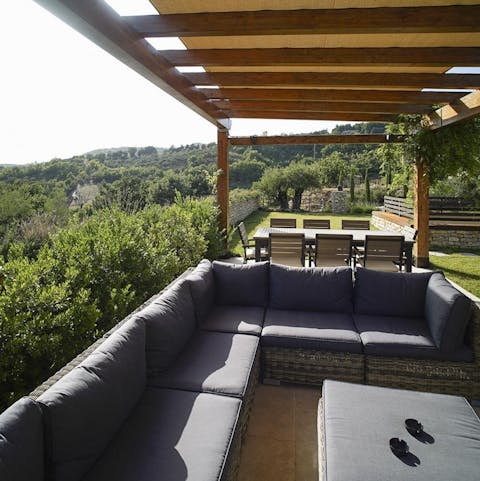 Gaze out over the Asissi Valley from the shaded outdoor lounge