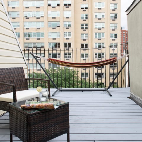 Relax on the terrace looking out over your UES locale and napping in the hammock