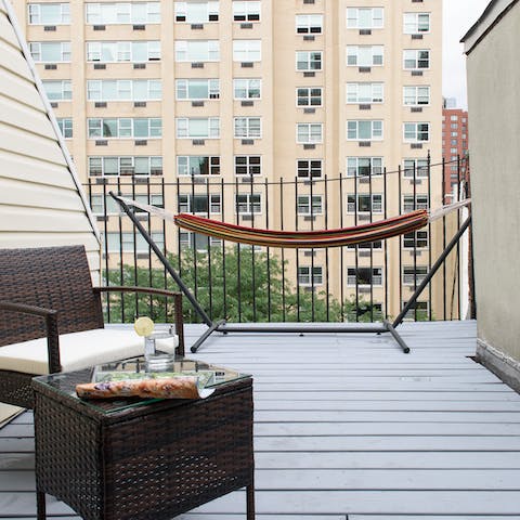 Relax on the terrace looking out over your UES locale and napping in the hammock