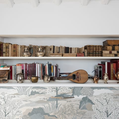 Admire the beautiful collection of antiques and books