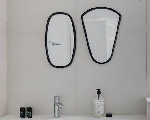 These sculptural mirrors in the bathroom