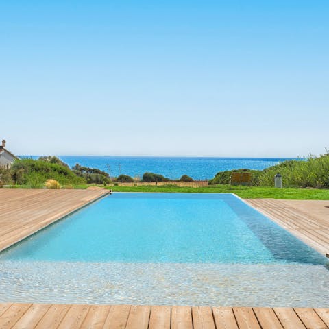 Enjoy views of the Mediterranean Sea as you swim about in the private pool