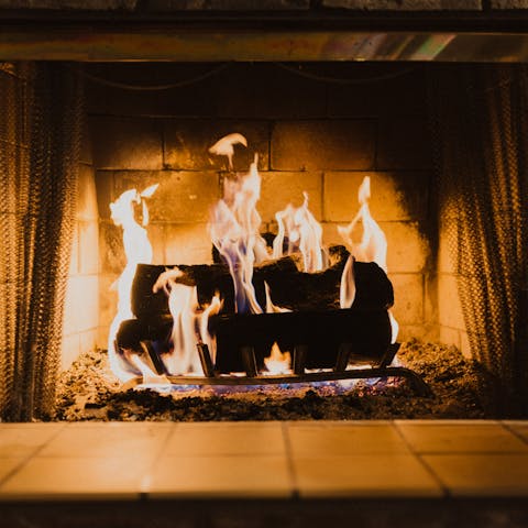 Snuggle up by the fire and savour a glass of Cretan wine