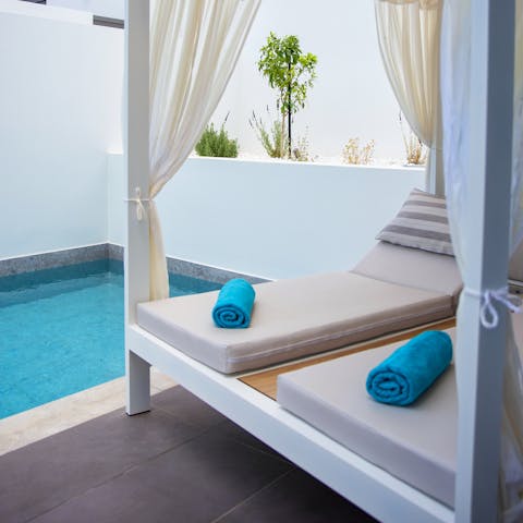 Indulge in a leisurely day of sunbathing by the private pool