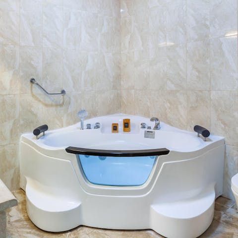 Unwind with a long, hot soak in the whirlpool bathtub