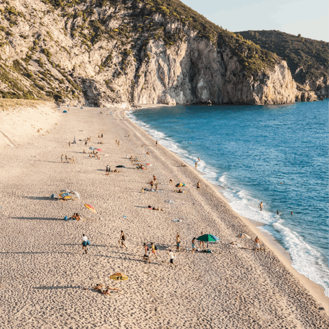 Soak up the sunshine from the sands of Hanioti Beach, 950m away