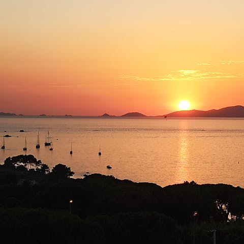 Stand transfixed at the amber-hued sunset over the Ajaccio Bay
