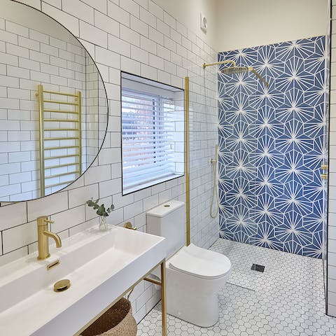 Wash away the sandy day beneath the luxurious rainfall shower