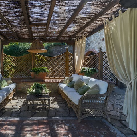 Settle down with a good book under the shade of the pergola