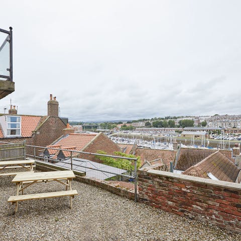 Tuck into takeaway fish and chips on a picnic bench on the terrace