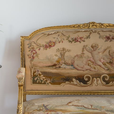 Appreciate the quintessential French charm of the home's antique pieces