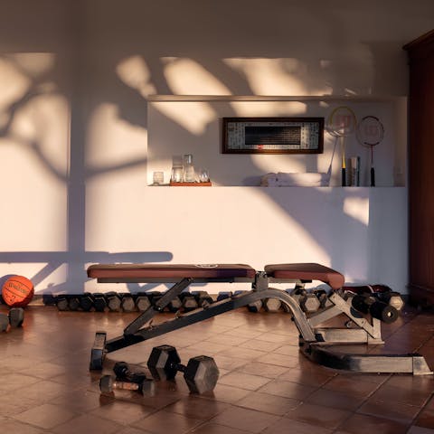 Give your muscles a workout with the weights in the on-site fitness room