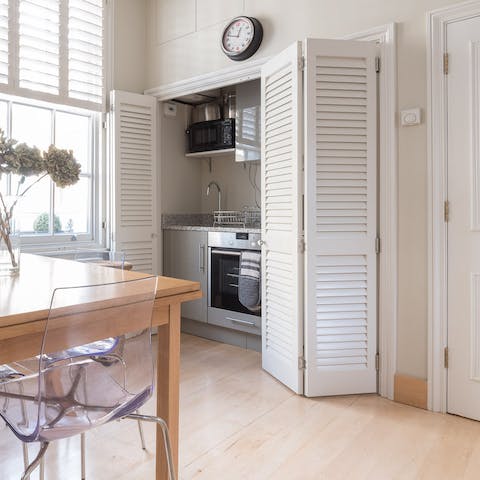 Close the folding doors over the hide-away kitchen after cooking up a feast