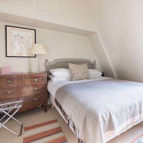 Return home from the city buzz and relax in the cosy bedroom space