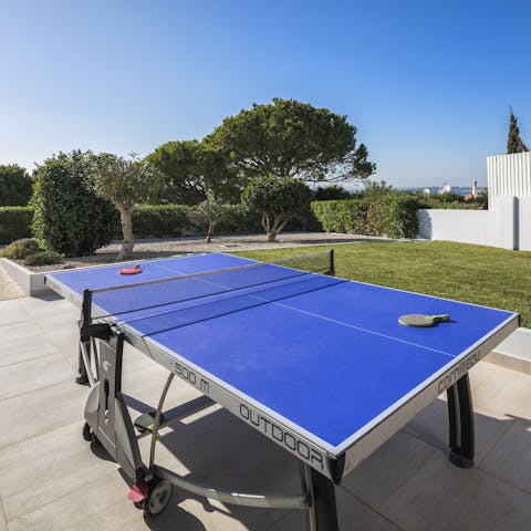 Enjoy a friendly game of ping pong in the sunshine
