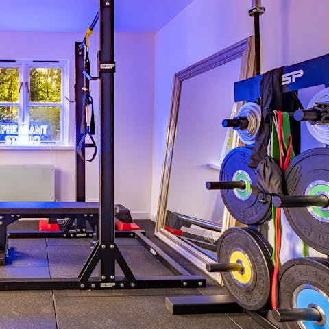 Pump iron in the home's gym located in a shed at the bottom of the garden