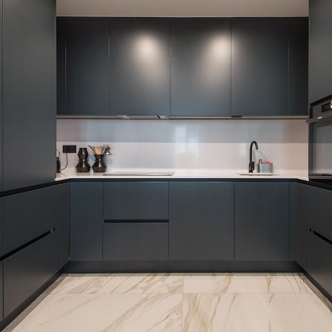 Dark kitchen units and marble