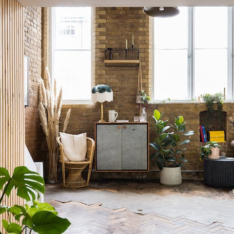 Kick back with a cocktail in the plant-filled living room