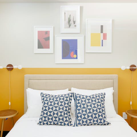 Wake up feeling chipper thanks to the comfy bed and colourful art