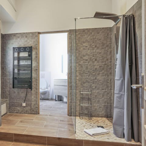 Pamper yourself in the luxurious bathroom with its rainfall shower