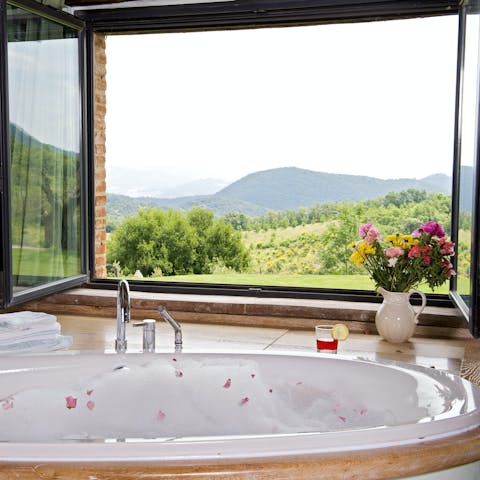 Treat yourself to a bath with a view of the vineyards