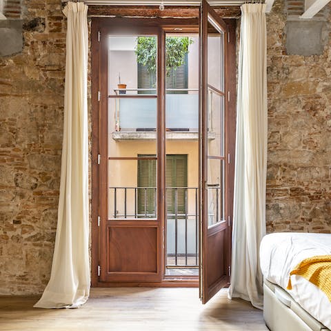 Open up the elegant French windows onto the balcony in your bedroom