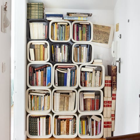 Delve into the home's own expansive library of books