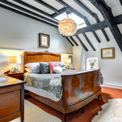 Slumber soundly in the wooden sleigh bed