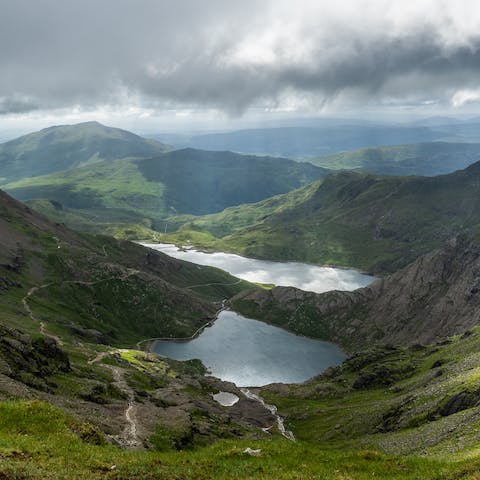 Take the Cadair Idris walk, which involves a steep ascent through a forested valley