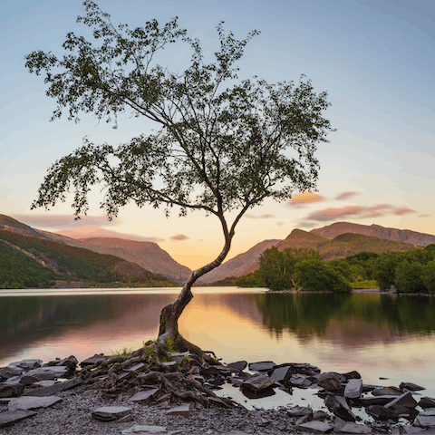 Enjoy the stunning dawn at Llyn Padarn, which is only a twenty-seven-minute drive away
