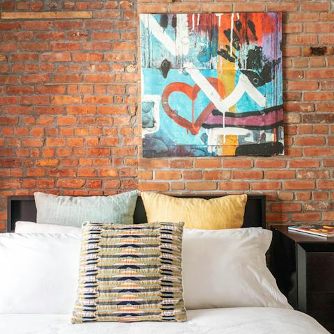 Take in the quirky graffiti-inspired artwork adorning the exposed brick walls