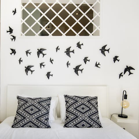 Get a restful night's sleep under the swallow-themed wall decoration