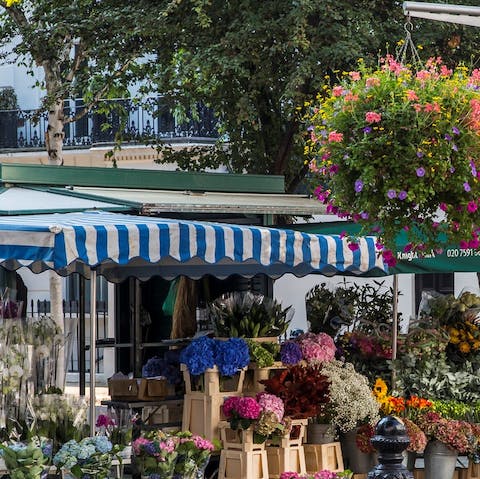 Pick out some fresh roses from a high street flower stall