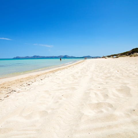 Wander 400 metres over to Son Serra's stretch of sandy beach