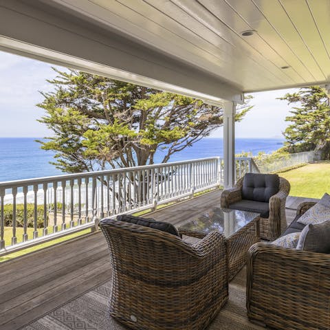 Gaze out over the glistening Pacific from the comfort of your covered porch