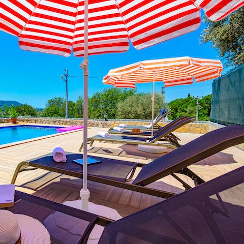 Soak up some vitamin D from the poolside sun loungers 