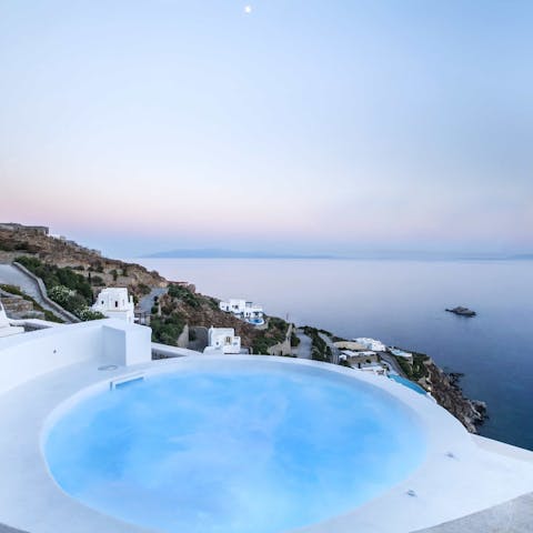 Relax in the bubbling Jacuzzi which showcases the Aegean Sea