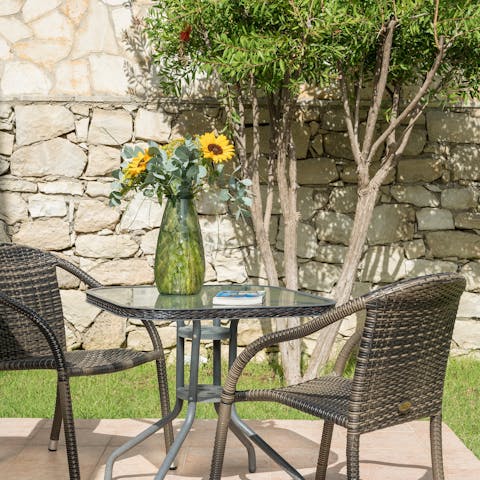 Steal away to enjoy coffee and a good book at this little bistro table