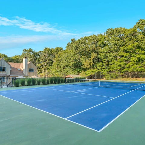 Start the day with a few sets of tennis on the private court