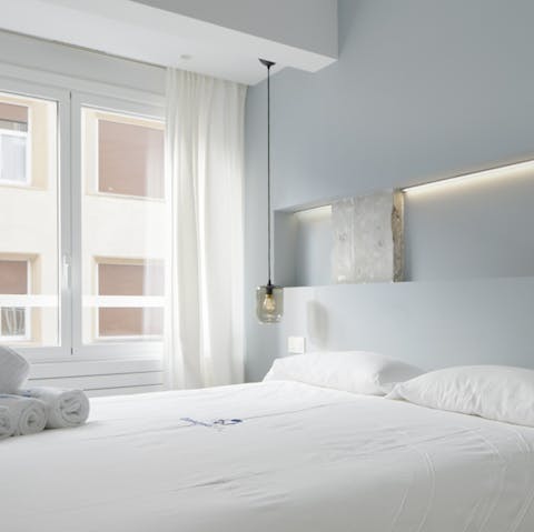 Wake up after a restful sleep and pry open the curtains to let natural light sweep through the room